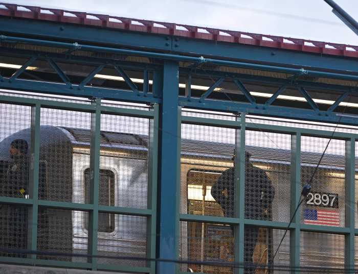 Brooklyn subway shooting: Detectives seek two suspects for wounding pair of men 6 Police investigate a double shooting at the Avenue U Q train station on Avenue U and East 15th St. in Brooklyn on Dec. 21, 2024.