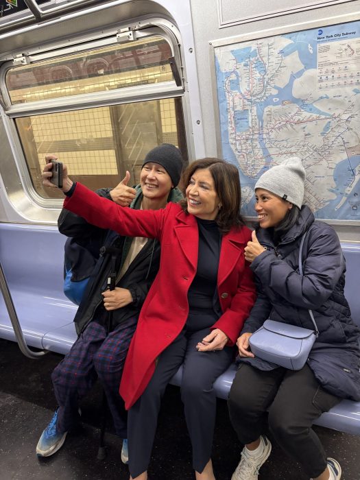 EXCLUSIVE | Governor Hochul talks subway security while riding the M train with amNewYork Metro 3 Governor Hochul takes a selfie with a pair of excited riders.