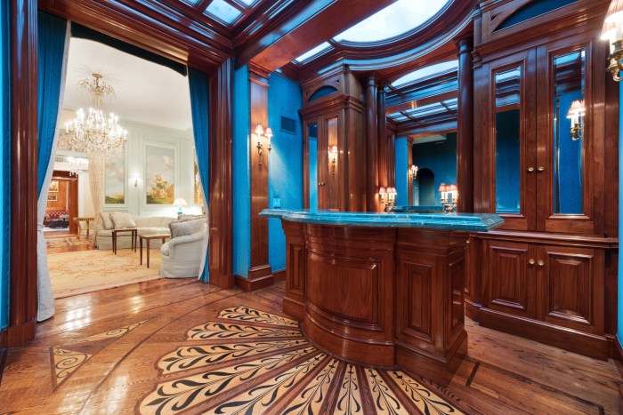 PHOTOS: Real estate magnate's $15 million home on Manhattan's Upper East Side hits the market 3 wood floor and bar inside luxury home