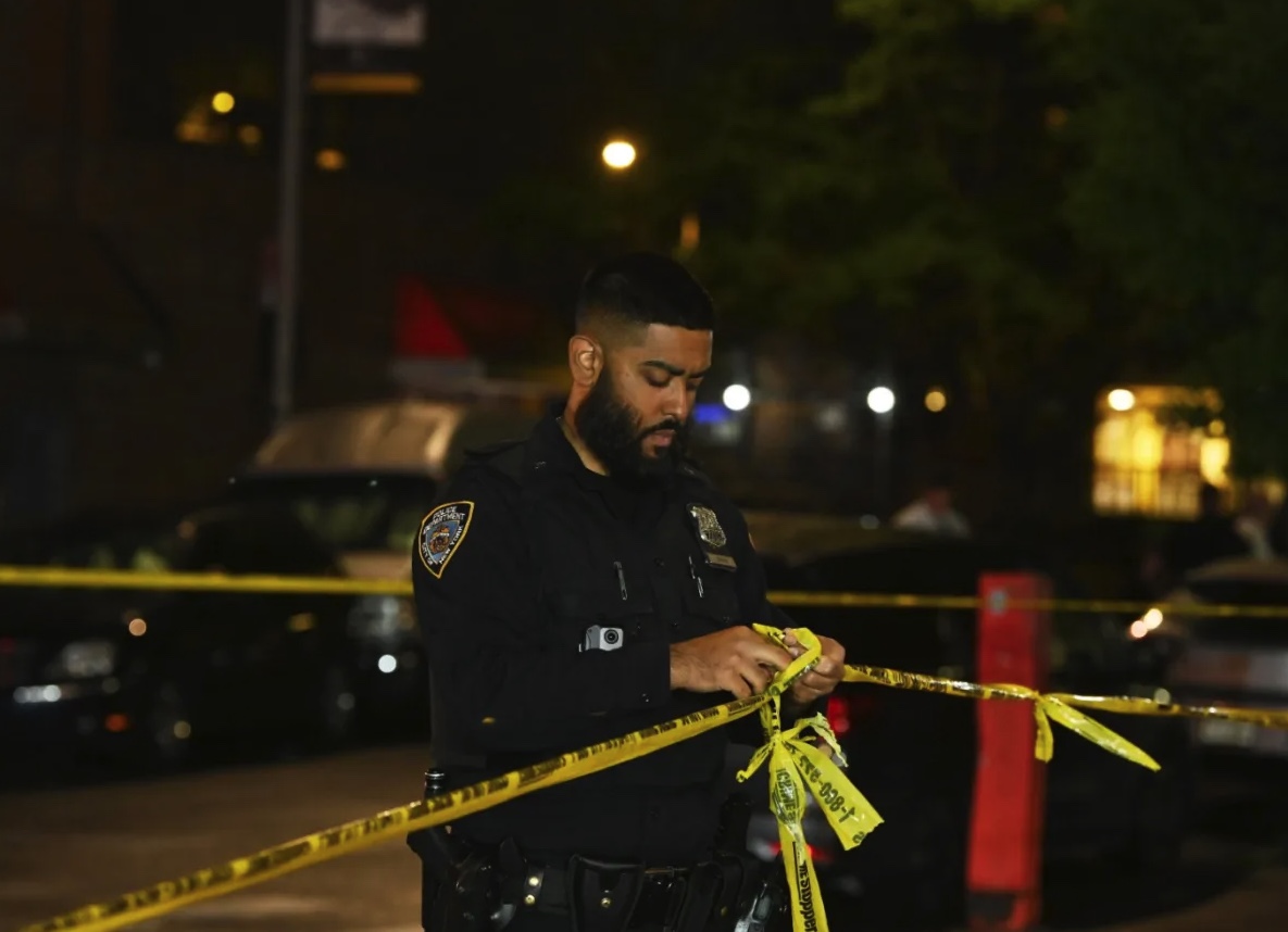 FILE - Police at a Brooklyn crime scene