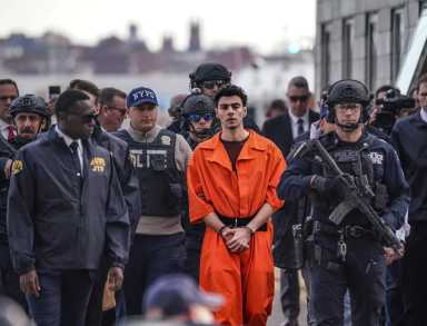 Luigi Mangione, the alleged Midtown assassin accused of fatally shooting UnitedHealthcare CEO Brian Thompson in front of a hotel earlier this month, returned to New York on Dec, 19 surrounded by armed cops in an historic perp walk.