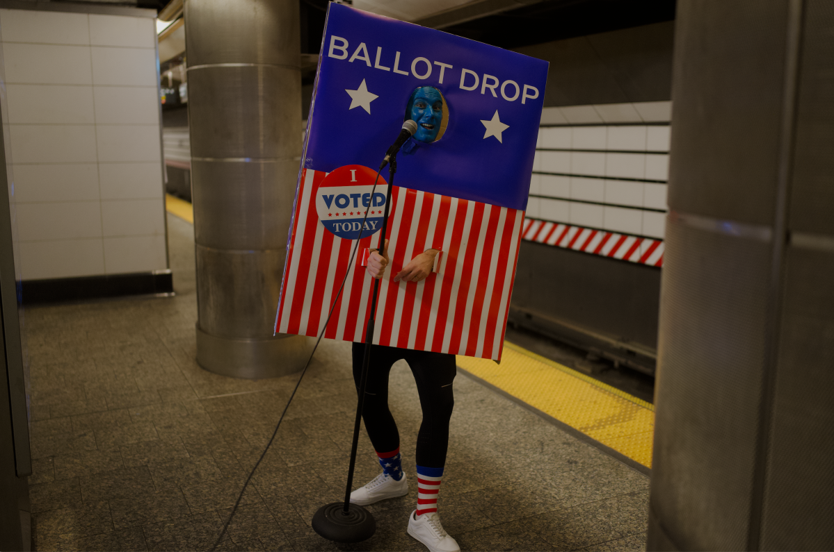 Marcus Monroe is making NYC straphangers laugh on their gloomy subway commutes 2 Comedian Marcus Monroe dressed as a ballot box on a NYC subway platform.