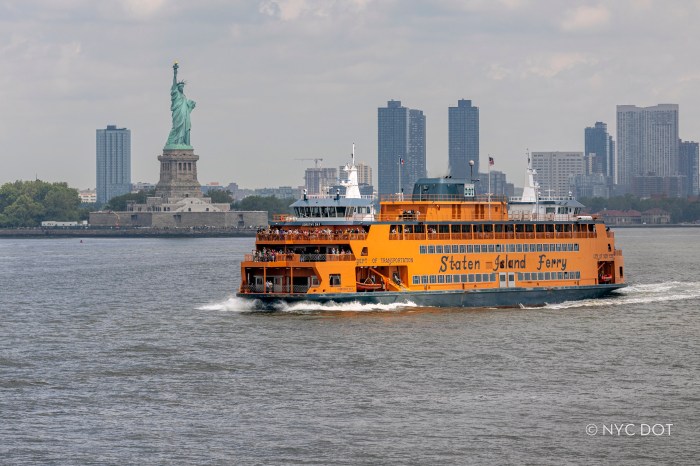 Staten Island Ferry boat in the water with the Statue of Liberty in view