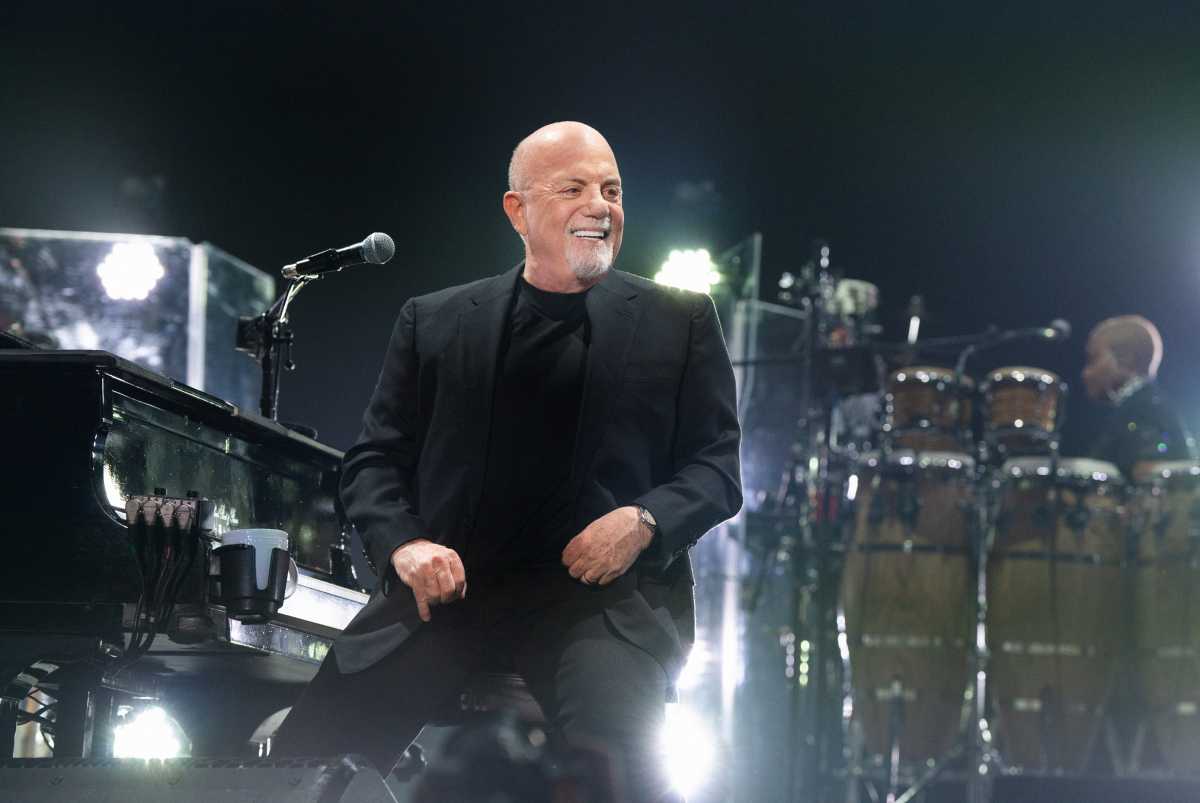 The 'Piano Man' and the Face: Billy Joel and Rod Stewart join forces for 'One Night, One Stage' at Yankee Stadium 1 Billy Joel singing at concert
