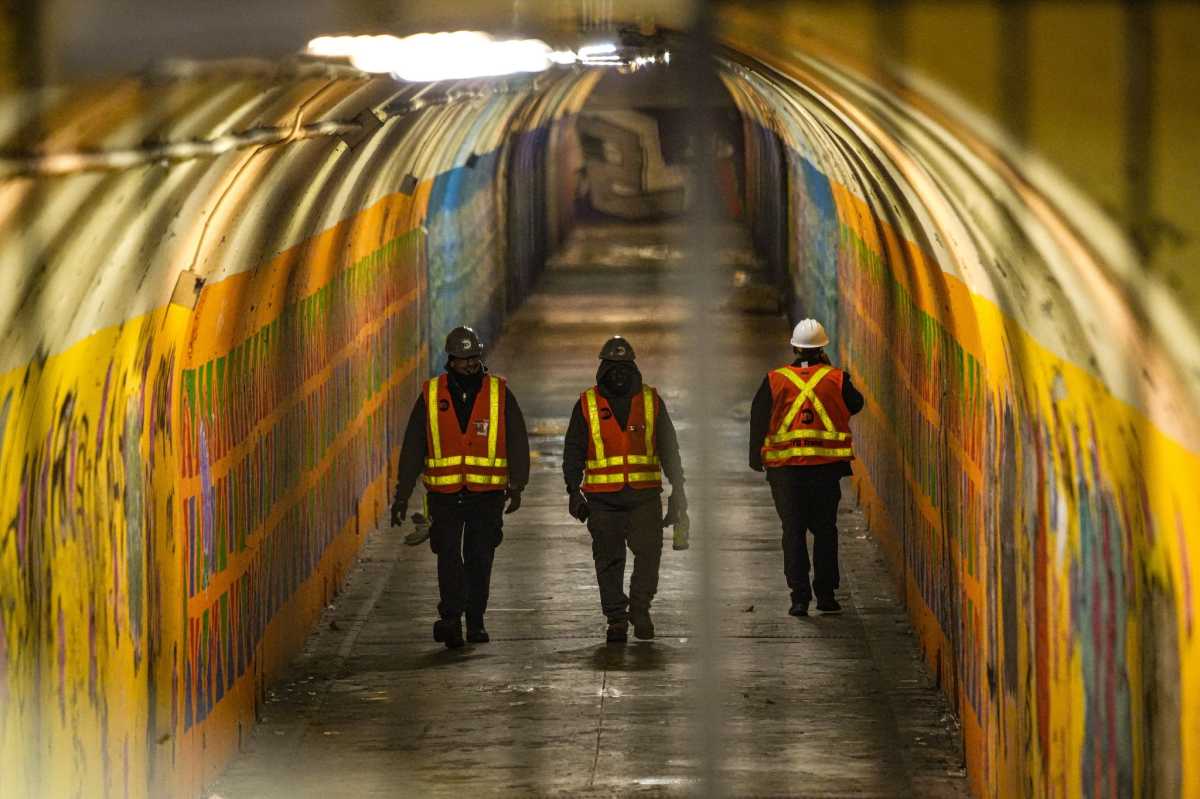 3 service mans in subway