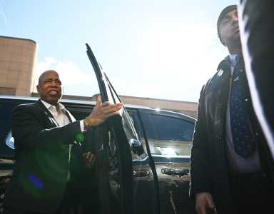 Mayor Adams exiting from vehicle