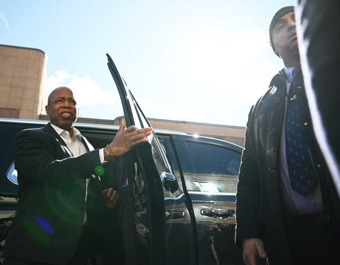 Mayor Adams exiting from vehicle