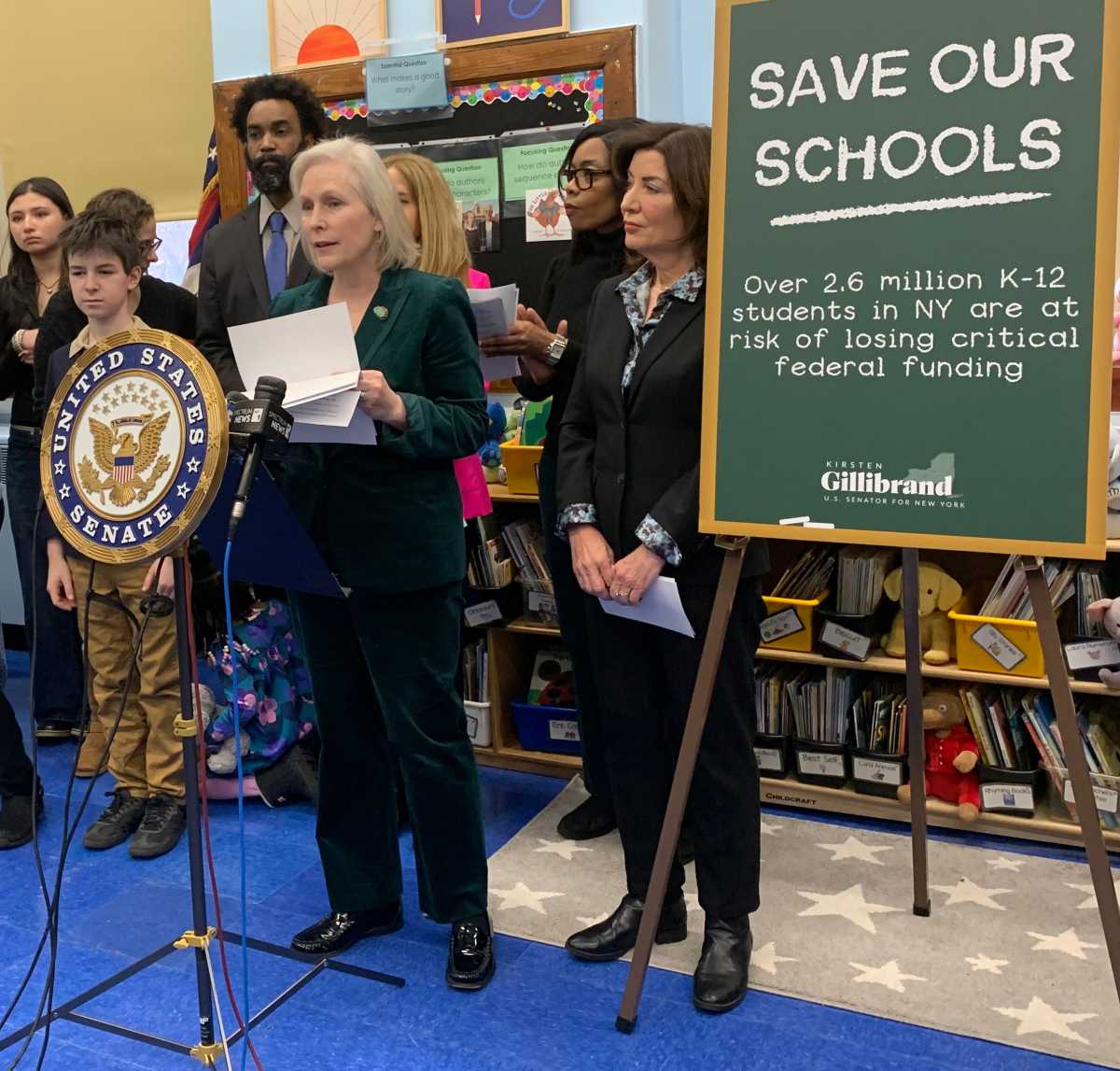 Sen. Kirsten Gillibrand at a podium in an education classroom
