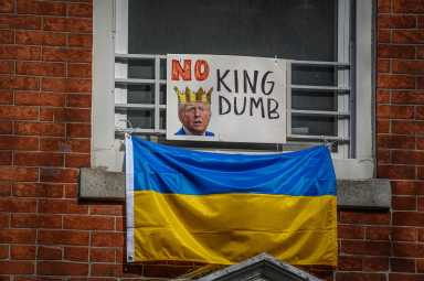 Little Ukraine residents pull no punches after Trump-Zelenskyy White House meeting, pause on military aid 2 Ukrainian flags can be spotted plastered across glass and hanging from window sills with photos of Trump reading “No kings.” Other banners read: “abort Prez Musk.”