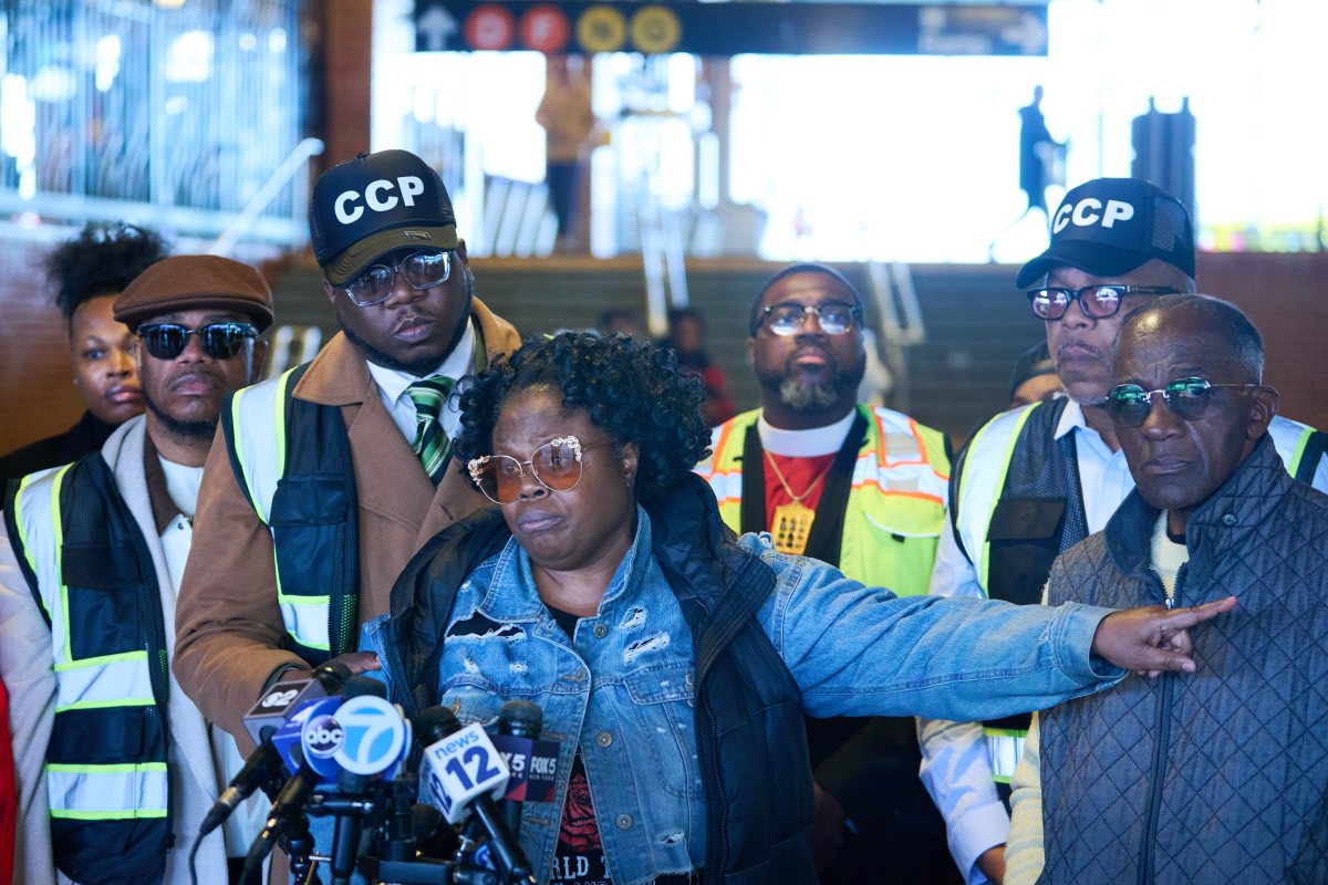 Coney Island mother, clergy demand arrests after teen's gang assault at subway station 4 Rev, Kevin McCall (left) stands with Monique Whyte who's son was assaulted at Stillwell Ave train station on Wednesday morning.