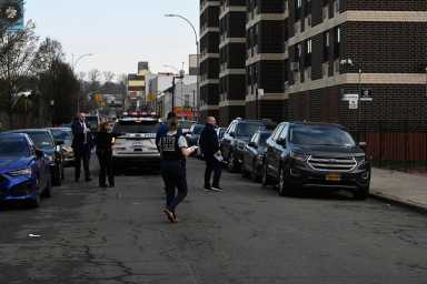 Two men shot on Brooklyn street in early-morning gunfire; suspect on lam, cops say 8 Police in Brooklyn at scene where two men were shot