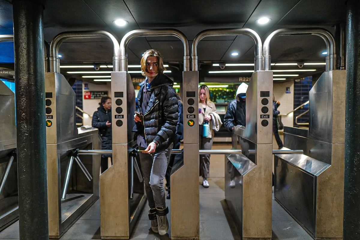 Subway rider entering turnstile