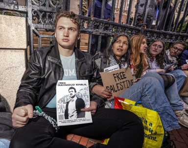 Columbia University protesters chain selves to gate