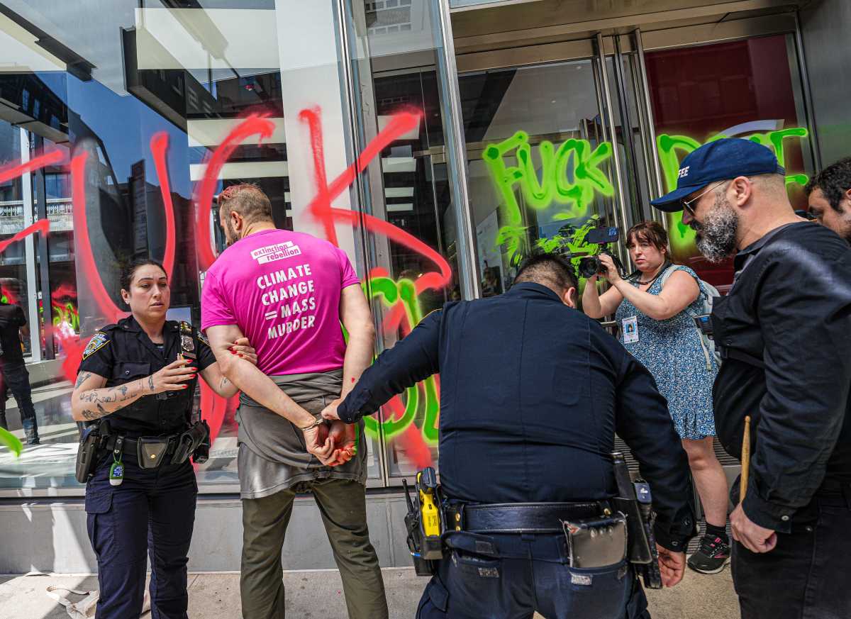 Caught red-handed: Environmental activists vandalize Tesla dealership in Manhattan to protest Elon Musk on Earth Day 5