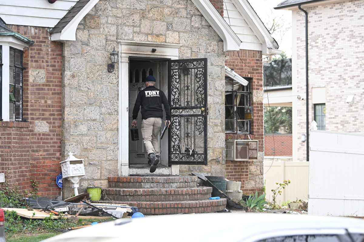FDNY official at the scene of a house fire in Queens