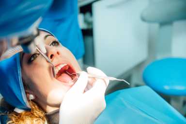 Thousands of New Yorkers face loss of dental providers due to controversial contract 13 Dentist examining a patient