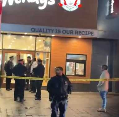 Police at scene of shooting at a Wendy's restaurant in the Bronx