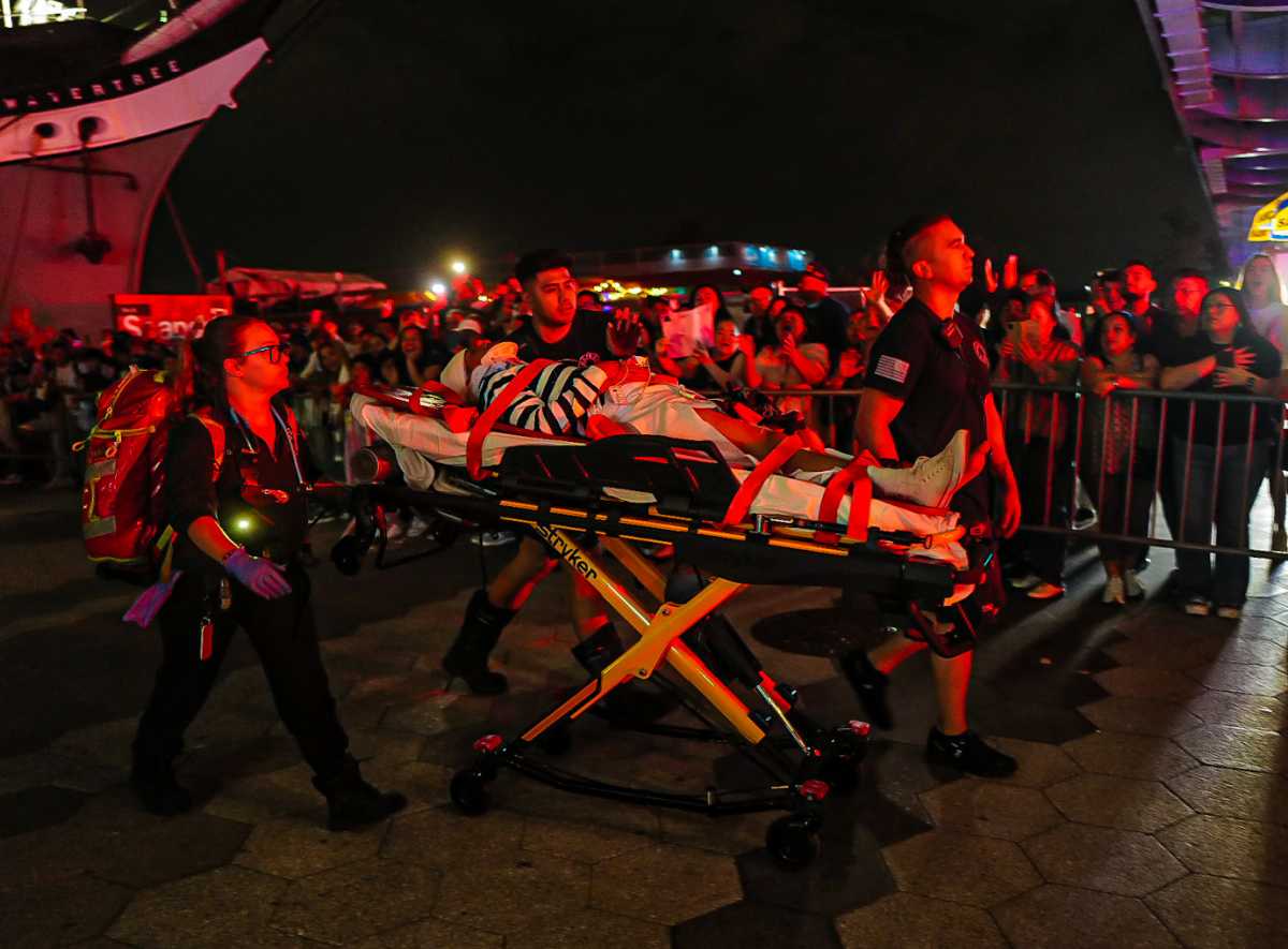 Ship crashes into the Brooklyn Bridge, leaving two dead 4 First responders rescue man on stretcher after ship crashed into Brooklyn Bridge