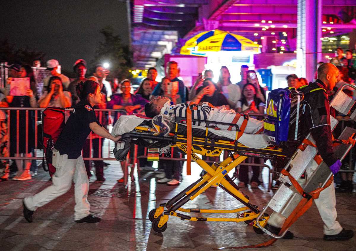 Ship crashes into the Brooklyn Bridge, leaving two dead 7 First responders rescue man on stretcher after ship crashed into Brooklyn Bridge