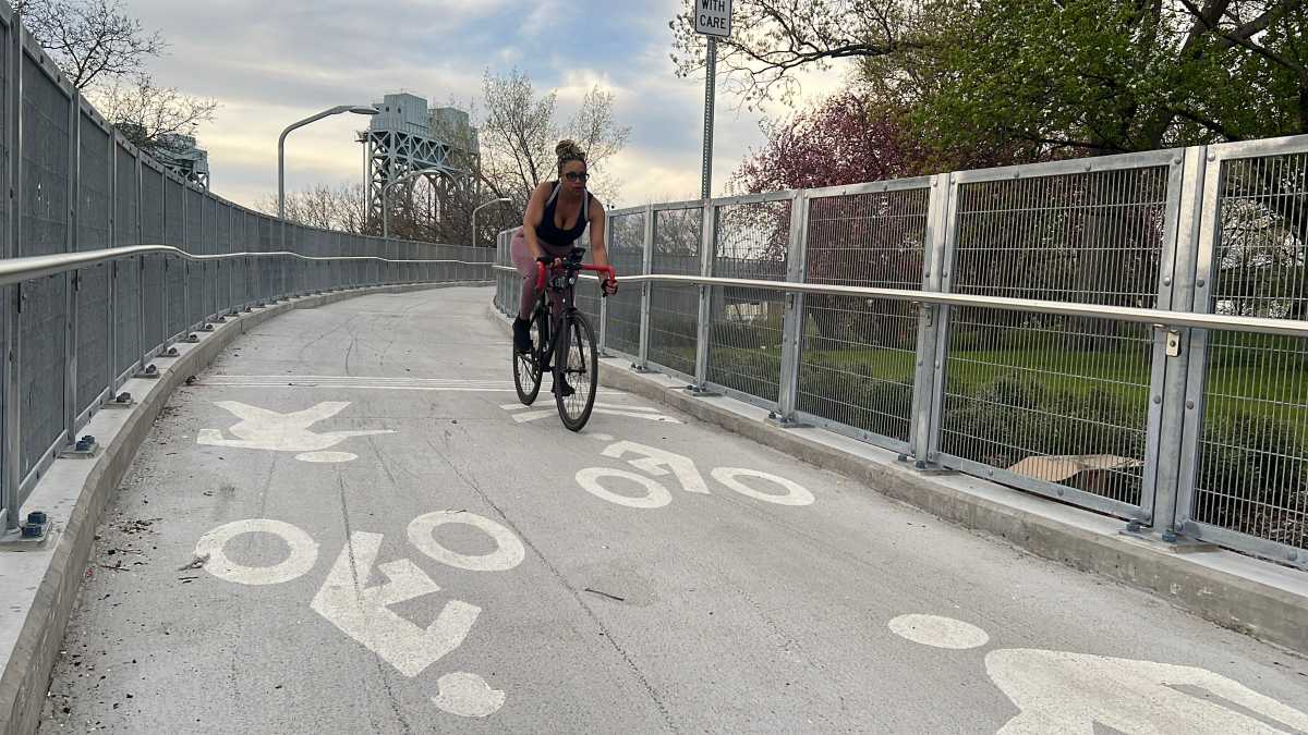 MTA opens a 'biker's paradise' on RFK-Triborough Bridge 2 woman riding bike on MTA RFK Triborough Bridge bike path