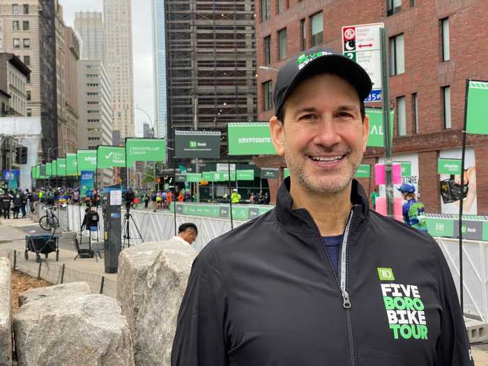 What rain? Thousands turn out for TD Five Boro Bike Tour through NYC on Sunday despite dreary skies 5 man wearing a TD Five Boro Bike Tour jacket