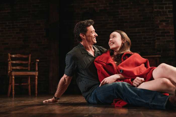 Off-Broadway show Hugh Jackman and Ella Beatty man and woman sitting on stage looking adoringly at one another