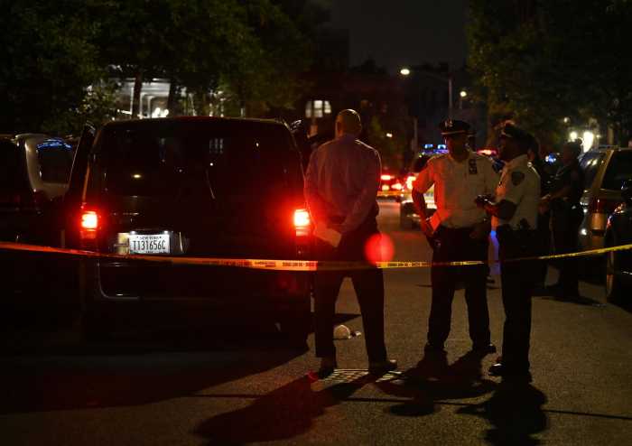 Queens shooting leaves man dead and another wounded as cops search for perp who pulled trigger 2 Cops at scene of Queens shooting