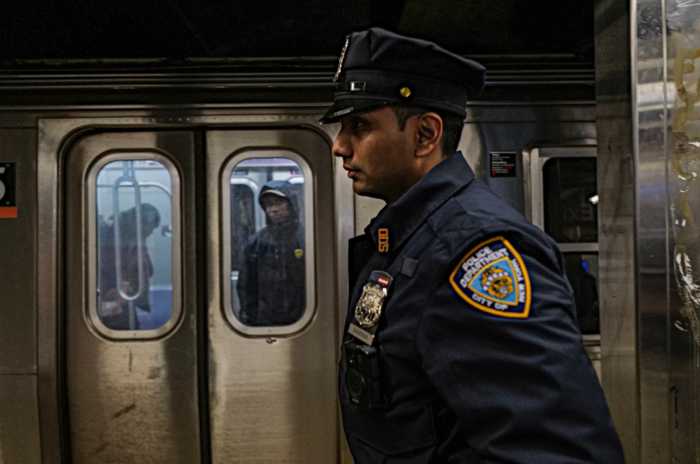 Police officer at a Brooklyn subway station