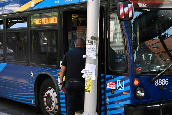 Queens man arrested after deadly stabbing on MTA bus in Brooklyn 2 Police officer enters a bus
