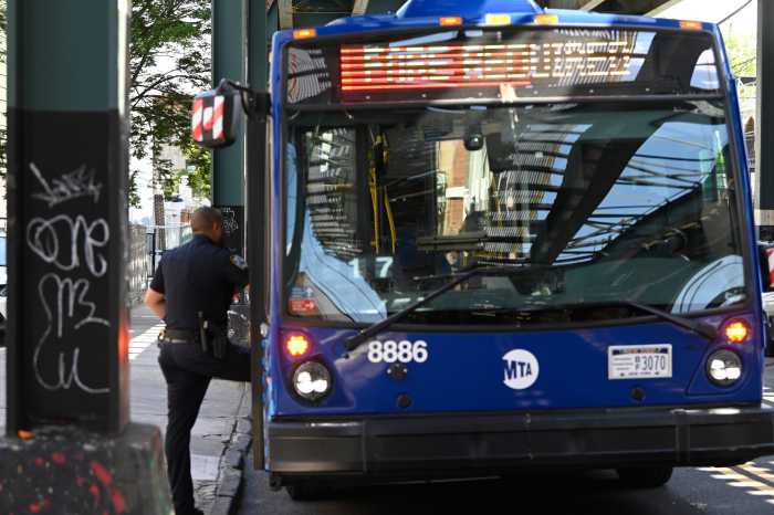 Brooklyn shuttle bus stabbing leaves man dead in horrific daytime attack 3 police officer standing at entryway on to a Brooklyn bus