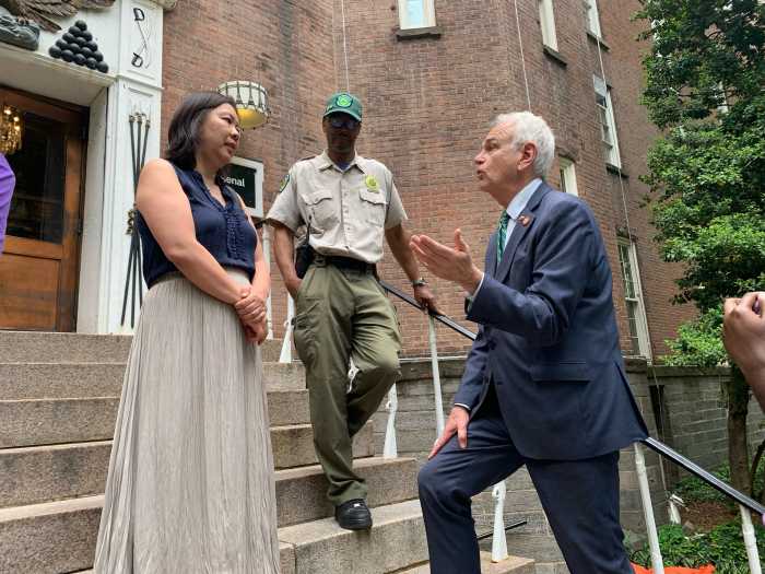 Parks and rides: NYC plans to permanently allow e-bikes and e-scooters on park drives, greenways 2 two men and a woman on steps at a NYC park.