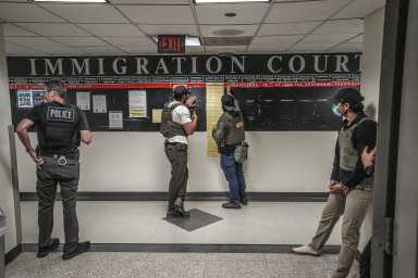 Masked ICE agents in immigration court in Lower Manhattan