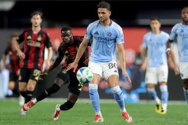 Jun 12, 2025; New York, New York, USA; New York City FC midfielder Justin Haak (80) controls the ball against Atlanta United forward Jamal Thiare (14) during the second half at Yankee Stadium. Mandatory Credit: Brad Penner-Imagn Images