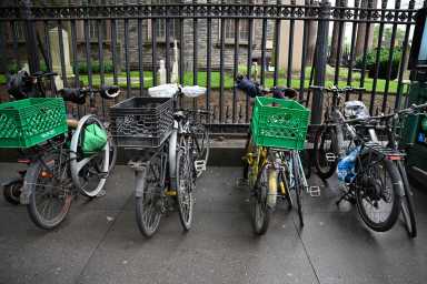 Instacart backs minimum wage hike for delivery workers, but conditions apply 8 set of bikes on a sidewalk