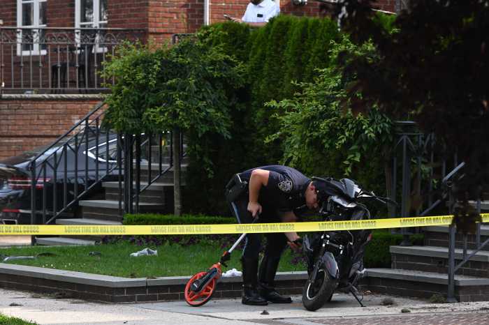 Police officer at site of moped crash in Brooklyn