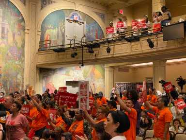 Going up: Rent Guidelines Board approves rent hikes on city’s stabilized units 11 People wearing bright shirts protesting rent hike