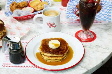 Grab a shake and go back in time: The Standard High Line debuts nostalgic diner pop-up 21 a spread of food at the Standard High Line