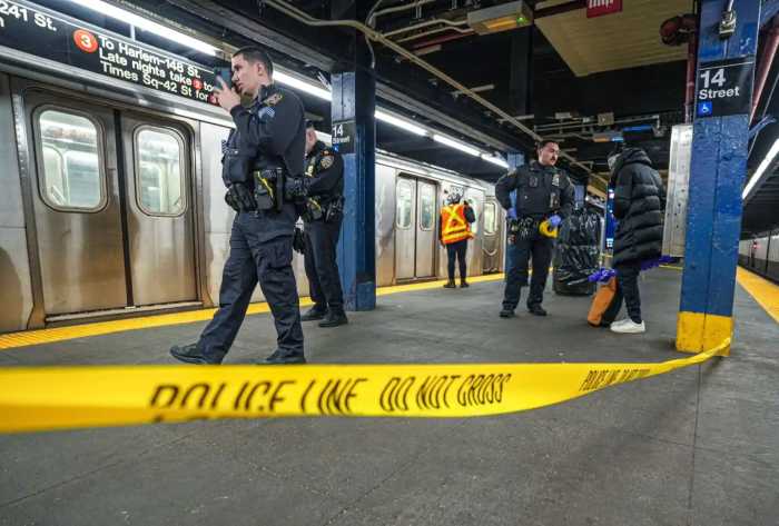 Bronx subway station sees two violent assaults just four hours apart: cops 4 nypd officers in blue on subway platform with yellow crime scene tape stretched