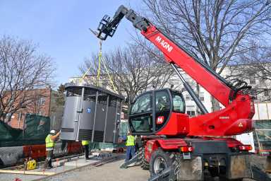 A modular Portland Loo restroom is delivered to Hoyt Playground in Queens, one of five installed across the city as part of a pilot program to expand public bathroom access