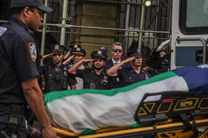 Body of slain Bronx cop killed in Midtown mass shooting released to his family as funeral rites begin 5 police officers saluting body of slain cop after midtown mass shooting