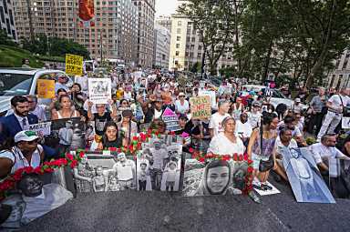 The mother of Dylan Contreras, the student detained by ICE in May wept outside of 26 Federal Plaza begging for the return of her son as thousands marched in protest of Trump's immigration policy. 