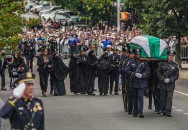 NYPD officer slain in Midtown mass shooting given a hero's tribute at Bronx funeral 30 police officers carry casket of slain cop as family mourns in background and officer salutes