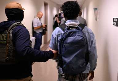 ICE detentions continue following lawsuit against sanctuary cities 11 A ICE Agent detains a man following a hearing at 26 Federal Plaza on the 14th floor on July 24.