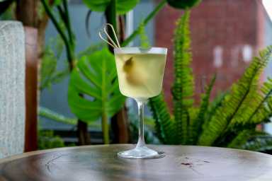 Meili Williamsburg: Where truffle dreams, street heat, and skyline sips collide 14 The Dirty Pepper cocktail, a green drink, at Meili Willamsburg.