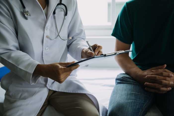 Editorial | ‘Big Beautiful’ pain 2 Male patient having consultation with doctor or psychiatrist who working on diagnostic examination on men's health disease or mental illness in medical clinic or hospital mental health service center