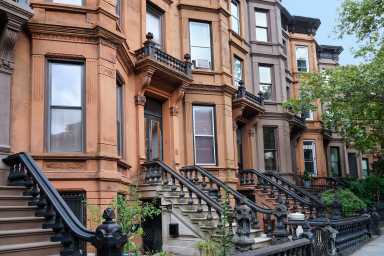 New York City, row of old brownstone townhouses with attractive detailed moldings