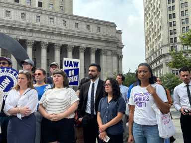 Legal Aid Society union ratifies contract that suspends wage negotiations for next year 11 Zohran Mamdani stands with a group at a union rally.