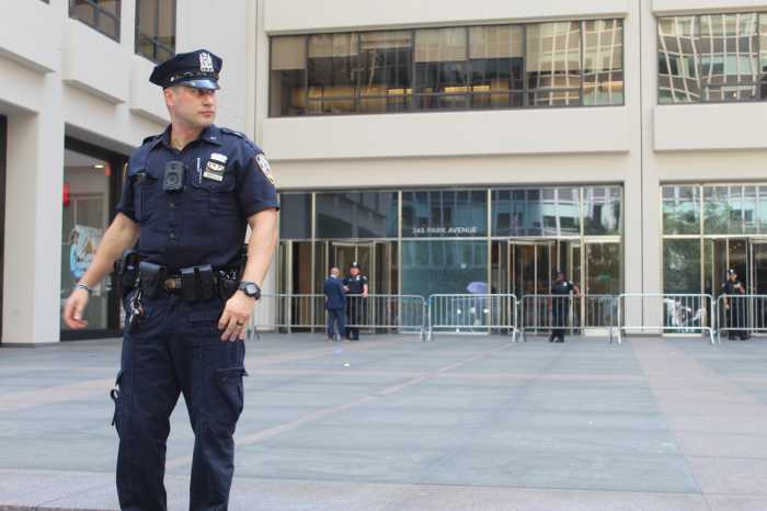 MIDTOWN MASS SHOOTING: Life resumes under eerie calm near Park Avenue office building the day after tragedy unfolded 3 A police officer stands guard at the entrance to 345 Park Ave., the point of entry for the gunman in Monday’s fatal Midtown shooting.