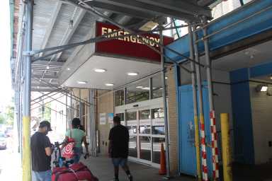 Legionnaires' disease outbreak in Harlem: 22 diagnosed, one dead in cluster of contagion 14 emergency room entrance at a hospital in Harlem with people walking by