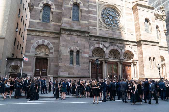 MIDTOWN MASS SHOOTING: Family and friends remember Julia Hyman as ‘bright light’ after tragic death 3 A large crowd of family, friends, and colleagues stands outside Central Synagogue following the funeral service for Julia Hyman